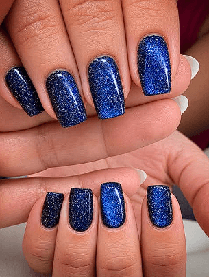 Navy blue sparkle cat-eye gel nails